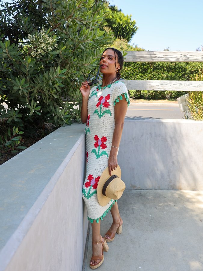 Instagram post by @brittbenae for STUART WEITZMAN. Caption reads: Officially Summer ☀️🌺 @stuartweitzman....