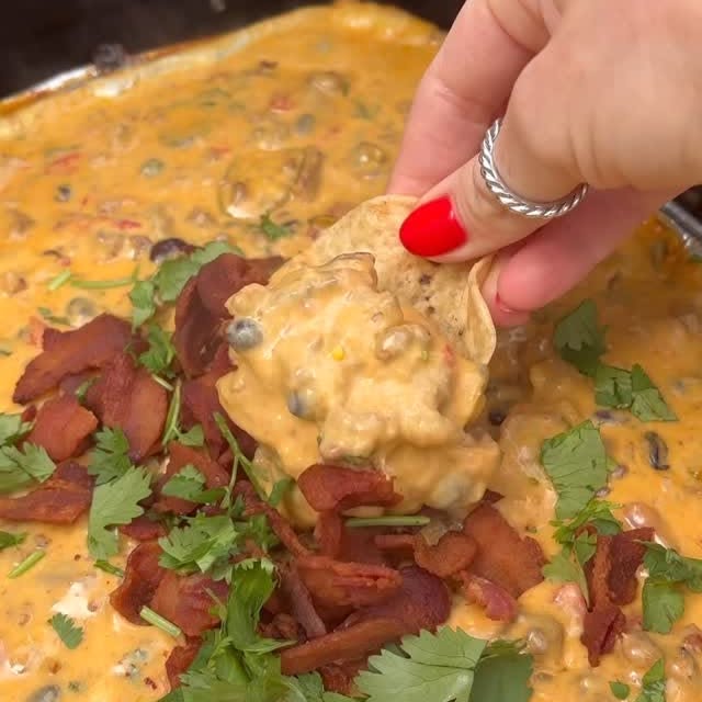 Instagram post by @tastewithnicki for Meijer. Caption reads: Smoked Cowboy Queso Recipe👇🤠

The best party....