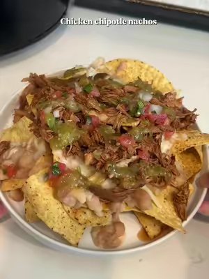 TikTok post by @theonlynaomix for EZ Bombs. Caption reads: [...] & so yummy chicken chipotle nachos 🤤 @EZ....