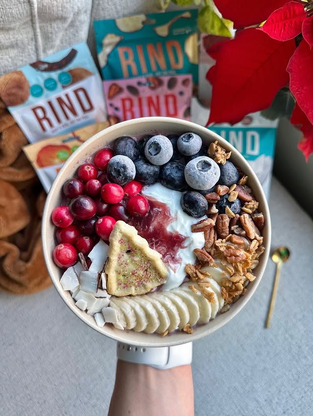 Instagram post by @miss.oat for RIND Snacks. Caption reads: @rindsnacks coconut crisps topped my festive [...].