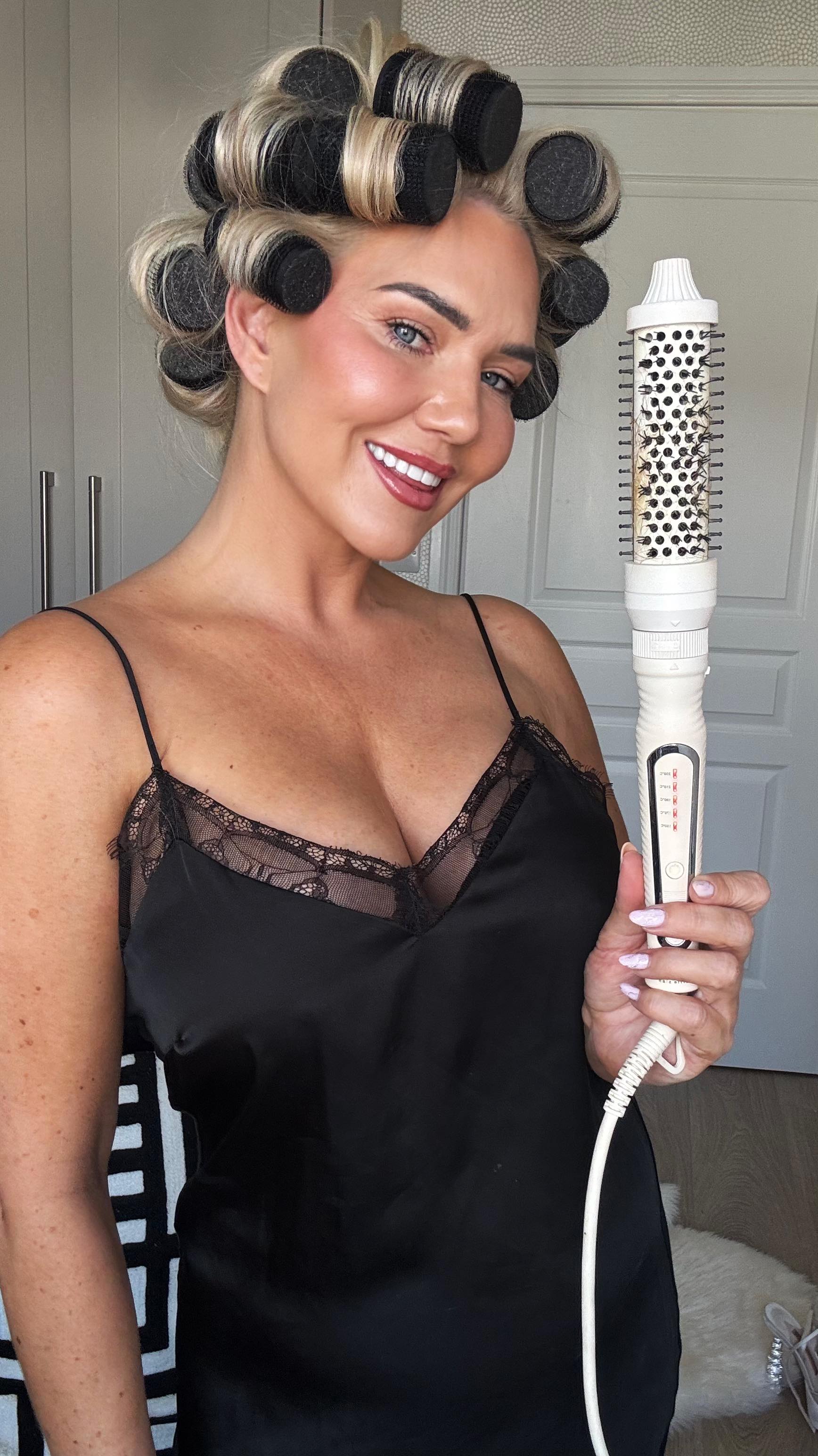 Instagram post by @erinmcgregor123 for Voduz Hair. Caption reads: #AD That big bouncy blow dry life ✨🔥 Using the....