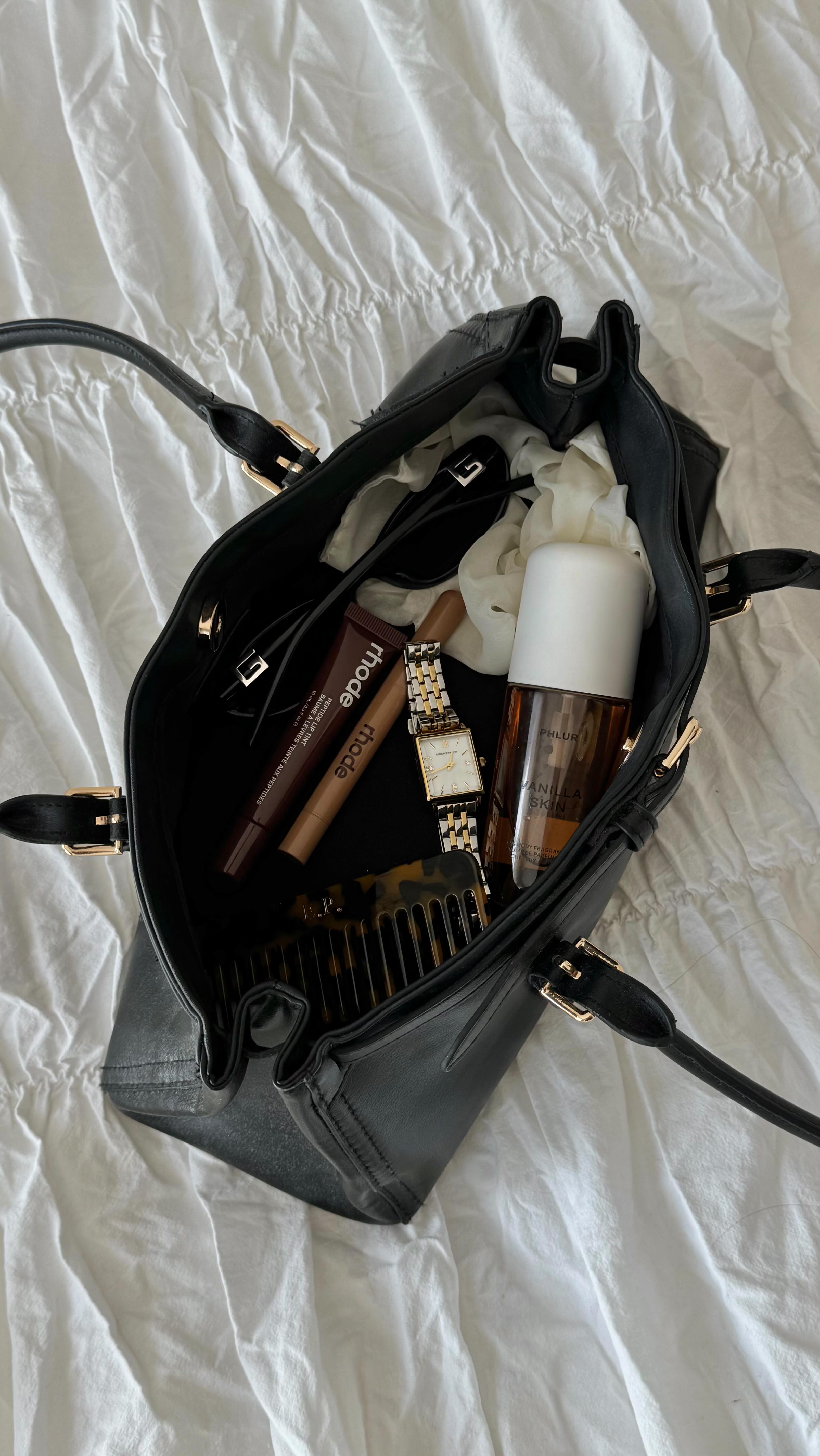 Instagram post by @eliizabeth.claire for Larsson & Jennings. Caption reads: Some of my current favourites ✨ 

@rhode Lip tint....