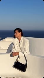 Instagram post by @kleofina for Lancaster. Caption reads: Salty hair, White suit & the iconic @lancaster....