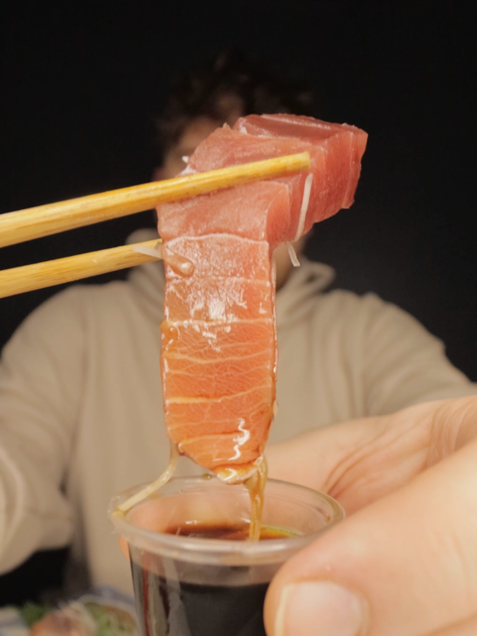 TikTok post by @mukbangmaxwell for Skyscanner. Caption reads: [...] last minute trip to Japan for snacks!....