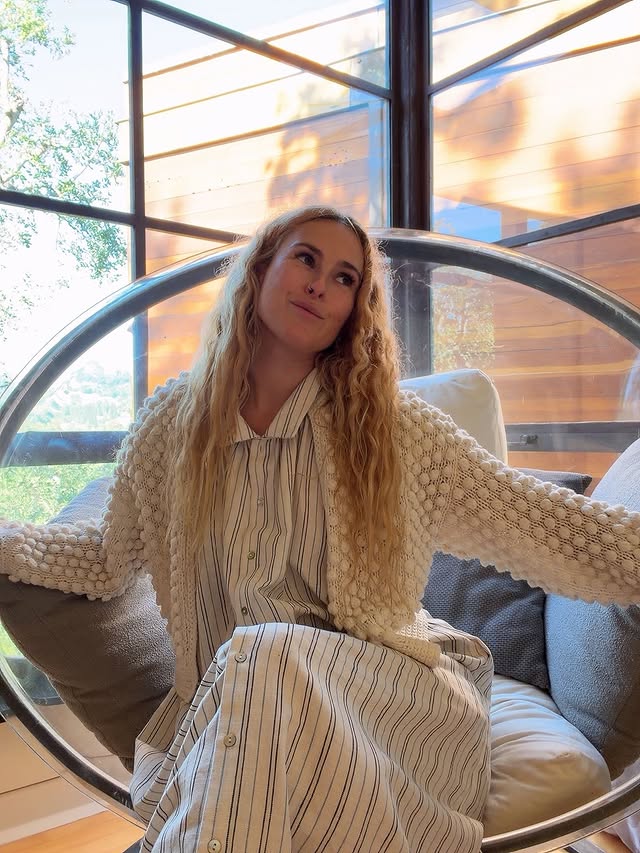 Instagram post by @rumerwillis for Christy Dawn. Caption reads: [...] the sunshine ☀️ lounging like a cat.....