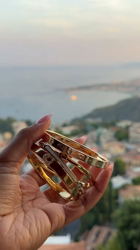 Instagram post by @a.wilkyy for Coach. Caption reads: The perfect stack with my @coach jewelry 🤩✨....