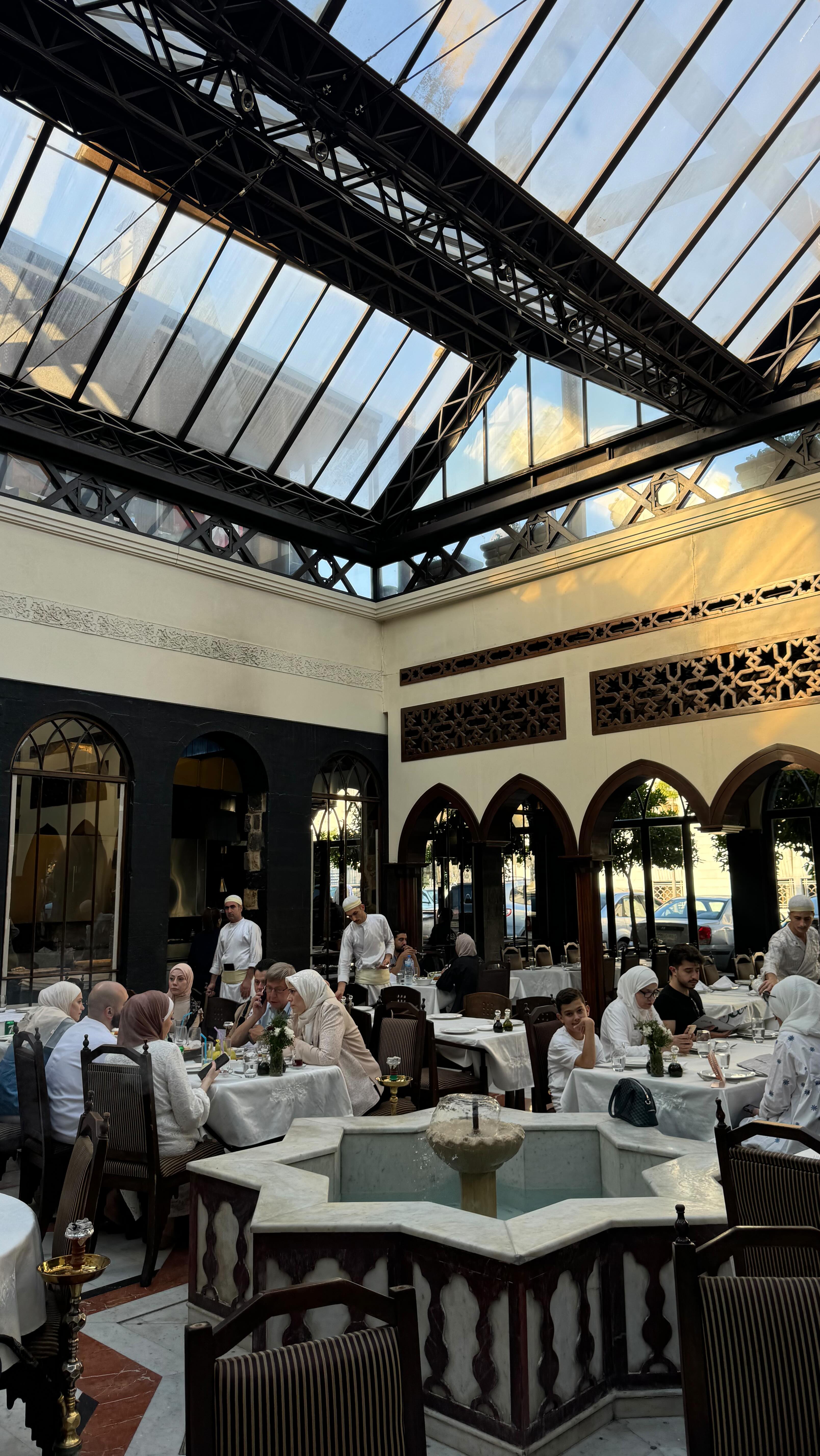 Instagram post by @nouraabdi_ for Veiled. Caption reads: Summer colors 💛 dress & hijab @veiledcollection....