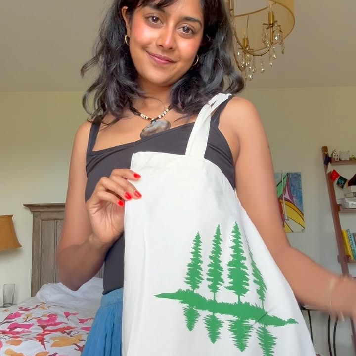 Instagram post by @karishmaclimategirl for TELUS. Caption reads: Come pack my @telus tree tote bag with me for a....
