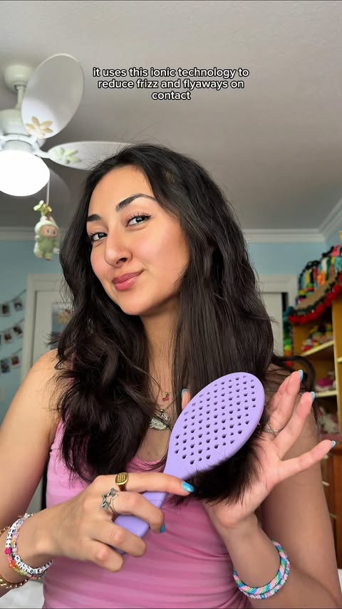 Instagram post by @sarahsundrop for Wet Brush. Caption reads: brushing away the frizz with @thewetbrush....