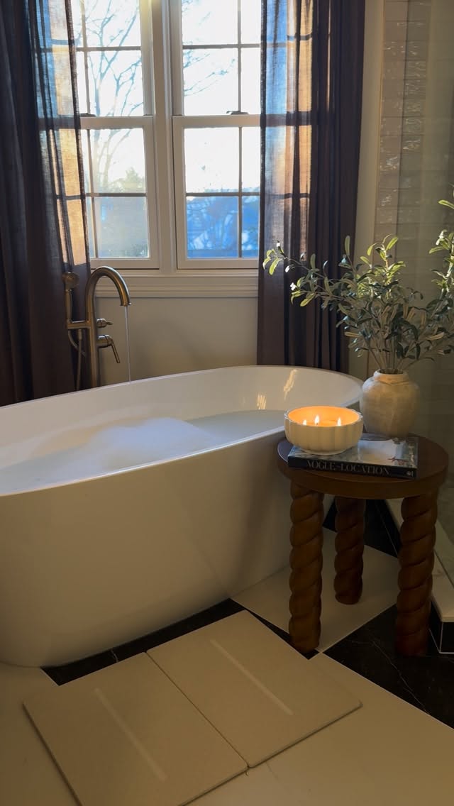 Instagram post by @homebyxi for Dorai Home. Caption reads: No more puddles on my bathroom floors or damp,....