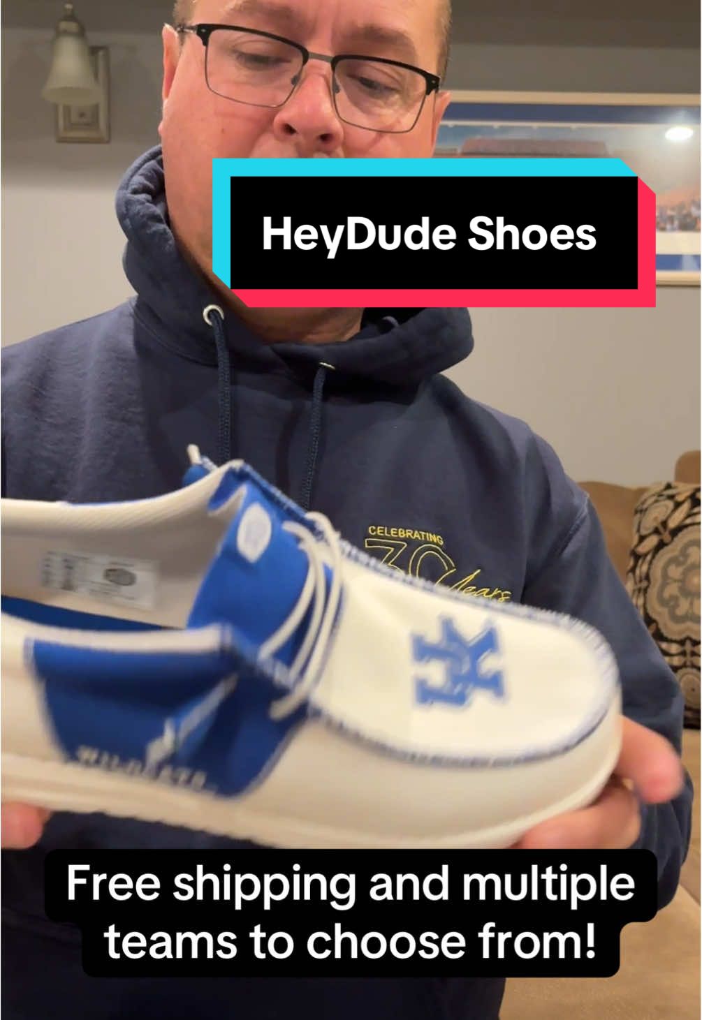 TikTok post by @handsomegroundman for HEYDUDE shoes. Caption reads: 🏈🏀Game day just got more comfortable! 🎓🔥....