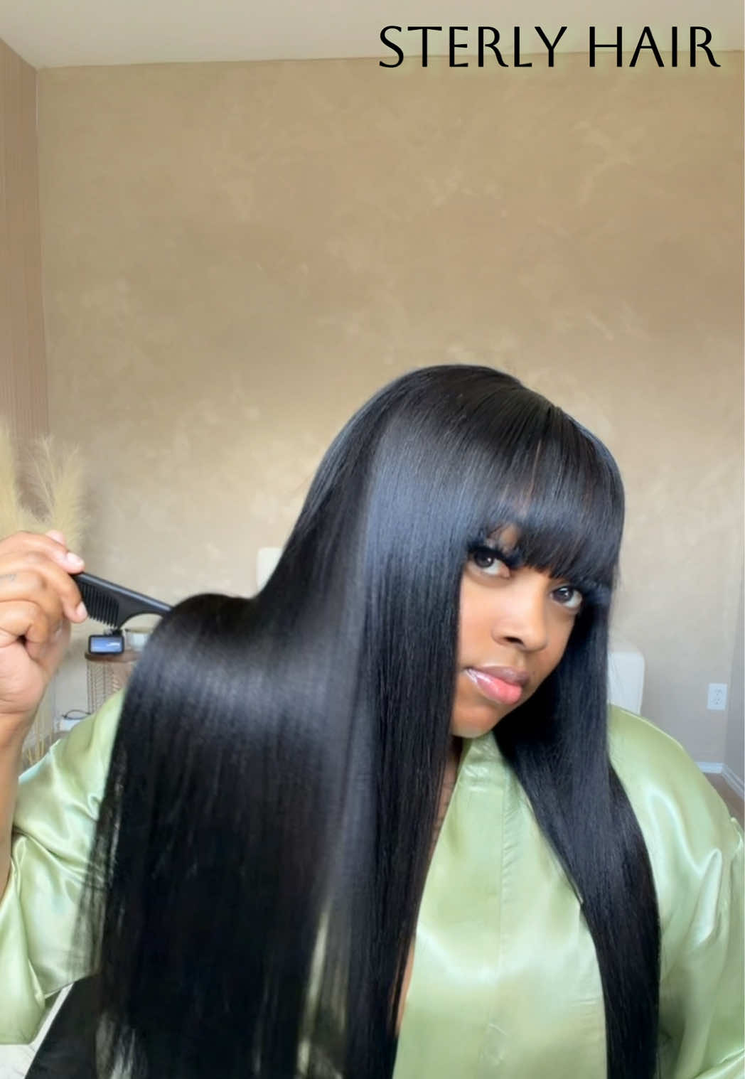 TikTok post by @stylisttraceyshenise for Sterly Hair Shop. Caption reads: A bang wig is absolutely perfect choice in every....