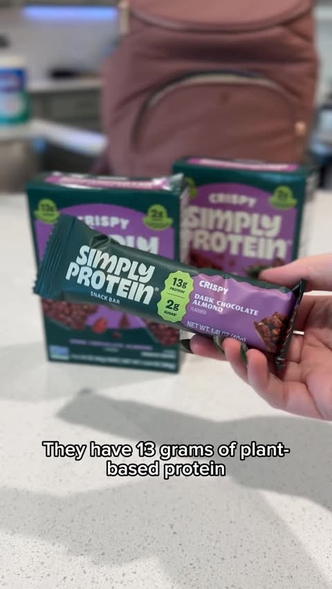 Instagram post by @laurynmc for SimplyProtein. Caption reads: @simplyprotein’s new Crispy Bars are the perfect....