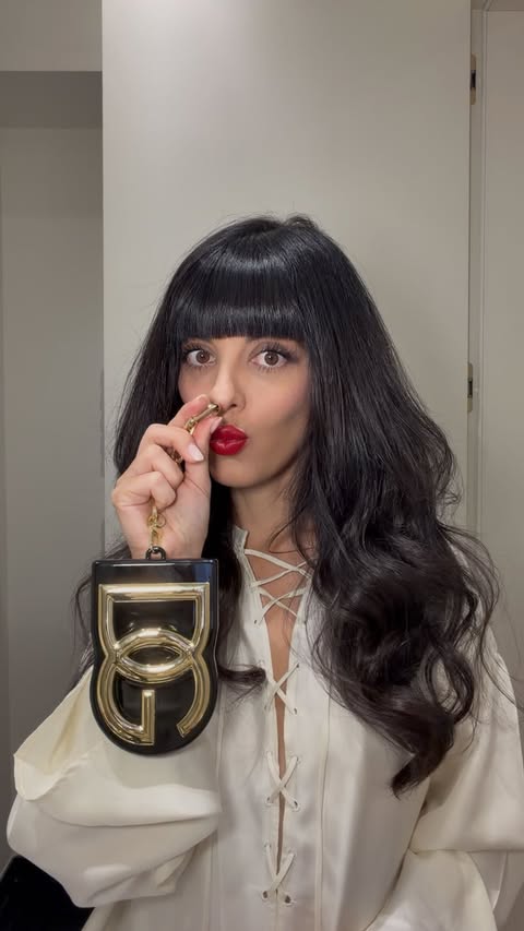 Instagram post by @lauracomolli for Dolce&Gabbana. Caption reads: This is your sign to wear red lipstick tonight....