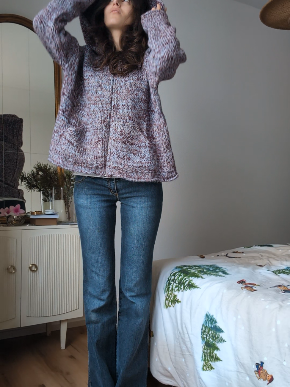 TikTok post by @annaiannaiannaianna for Urban Outfitters. Caption reads: [...] I got he coziest sweater ever from @Urban....