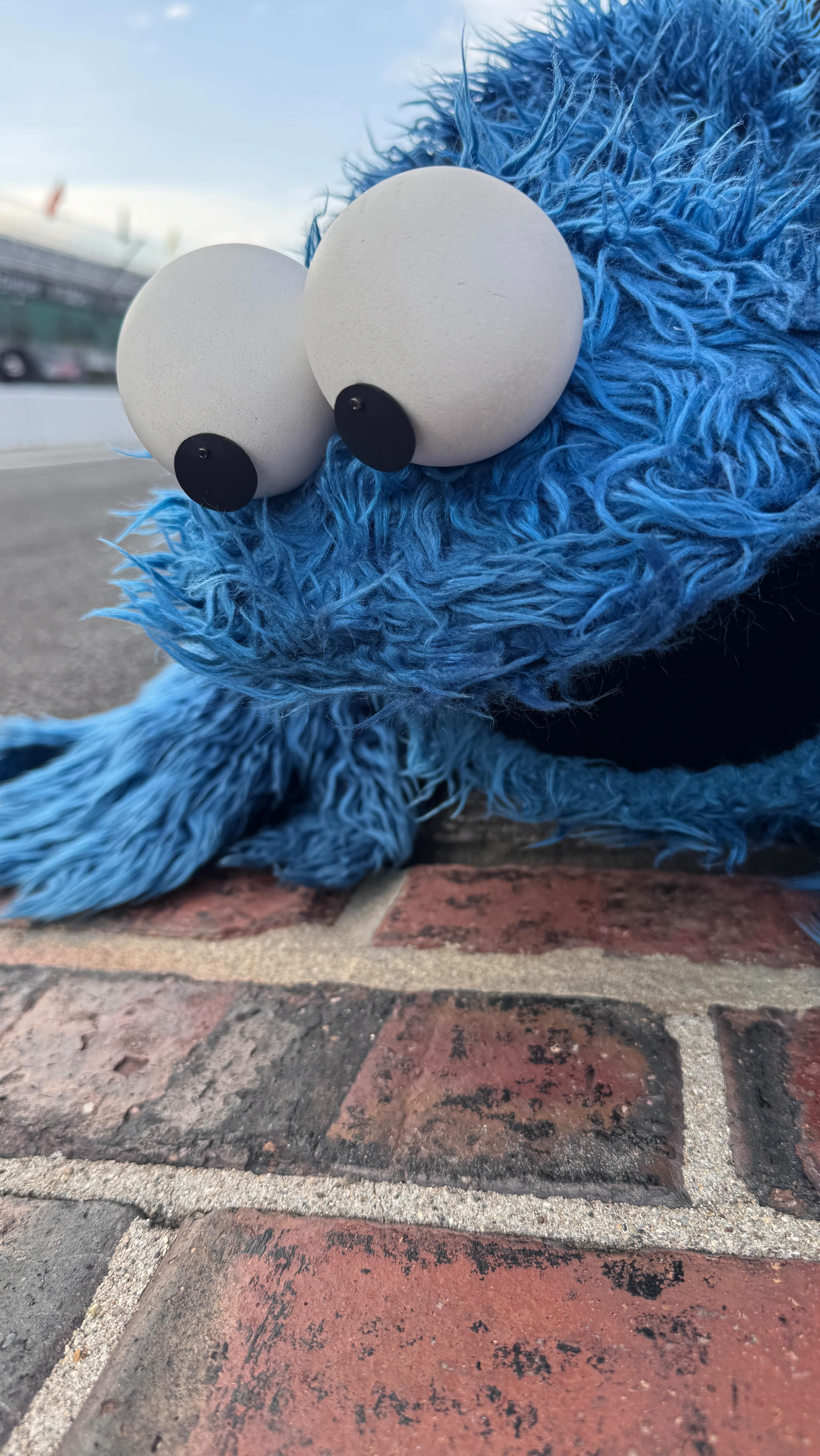 Instagram post by @cookiemonster for Sesame Street. Caption reads: Vroom vroom and nom nom! From counting laps to....