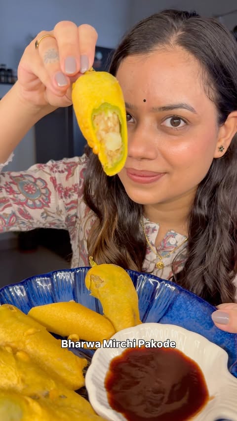 Instagram post by @reliving_pardesi for Fortune Foods. Caption reads: Bharwa Mirchi Ke Pakode #ad Recipe Mirchi 6-8....