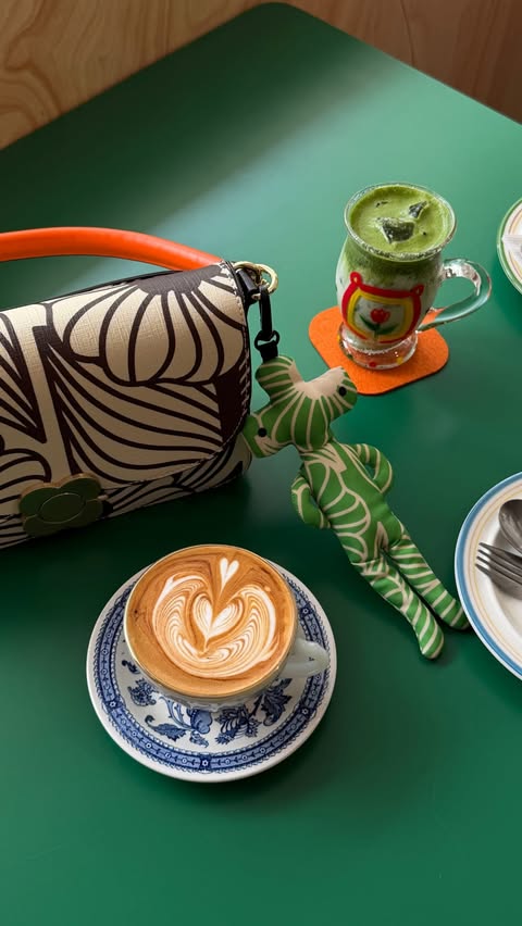 Instagram post by @cavina for Orla Kiely. Caption reads: A little Bangkok outing with @orlakiely 💚 Believe....