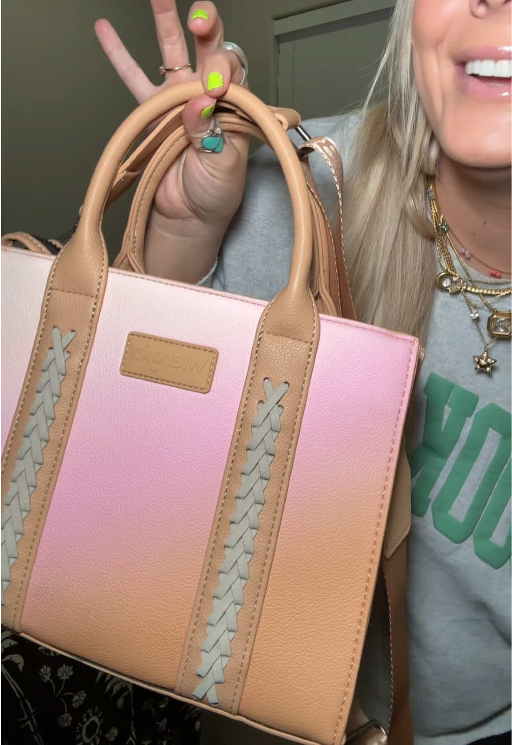 TikTok post by @thedesertgroove for Rustic Charm Bootic. Caption reads: [...] get enough of this bag!!! 🤎 @Rustic Charm....