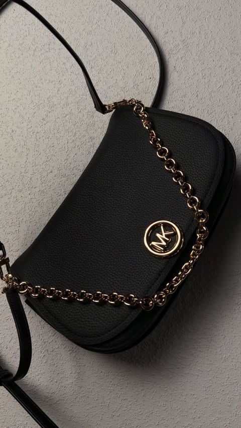 Instagram post by @karindennisha for Michael Kors. Caption reads: [...] became my go-to this season 🤍

@michaelkors....