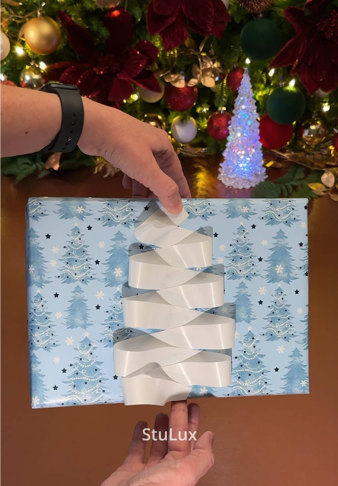 TikTok post by @stu.lux for Little ELF Products. Caption reads: [...] EASY Gift Wrapping - I used the @Little ELF....