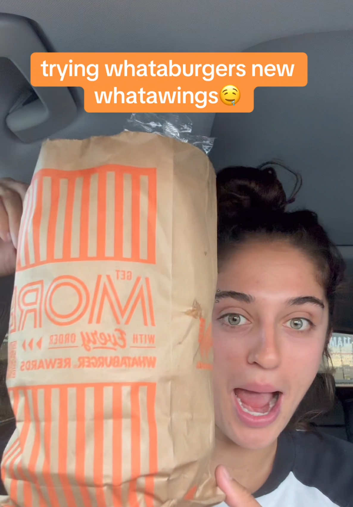 TikTok post by @averycyrus for Whataburger. Caption reads: The #Whatawings from @Whataburger are an absolute....