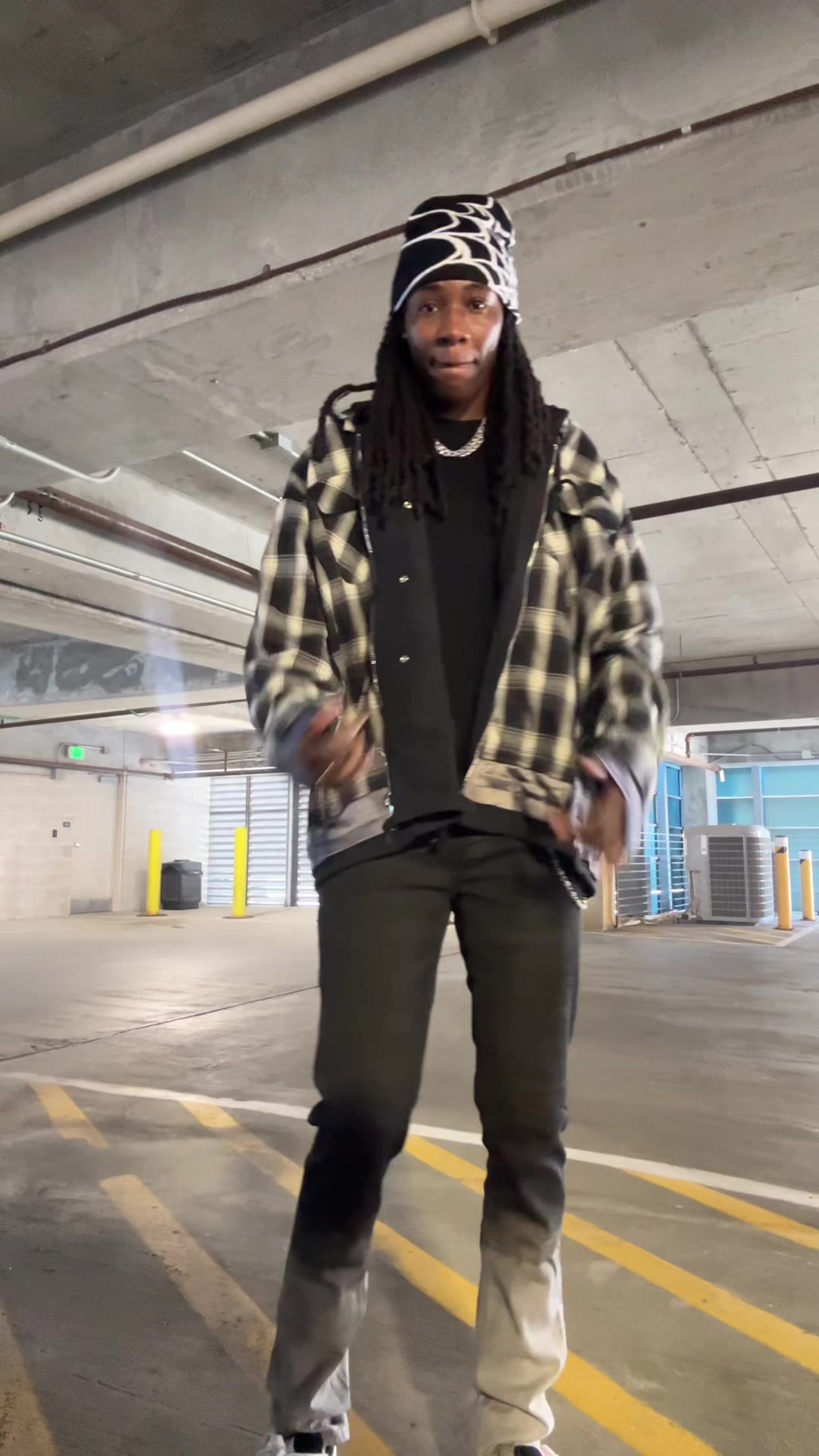 TikTok post by @t.howard6 for mnml. Caption reads: GameDay fit  @mnml  #fashiontiktok #streetwear....