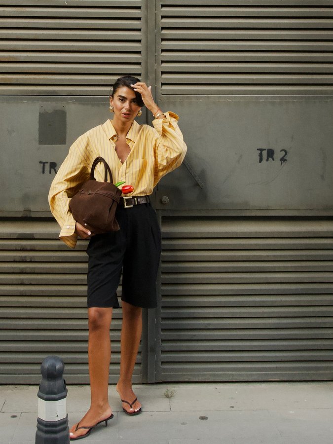 Instagram post by @selennergiz for Fashion Inspiration. Caption reads: A feminine touch to the boyfriend shirt🤎 #fyp....