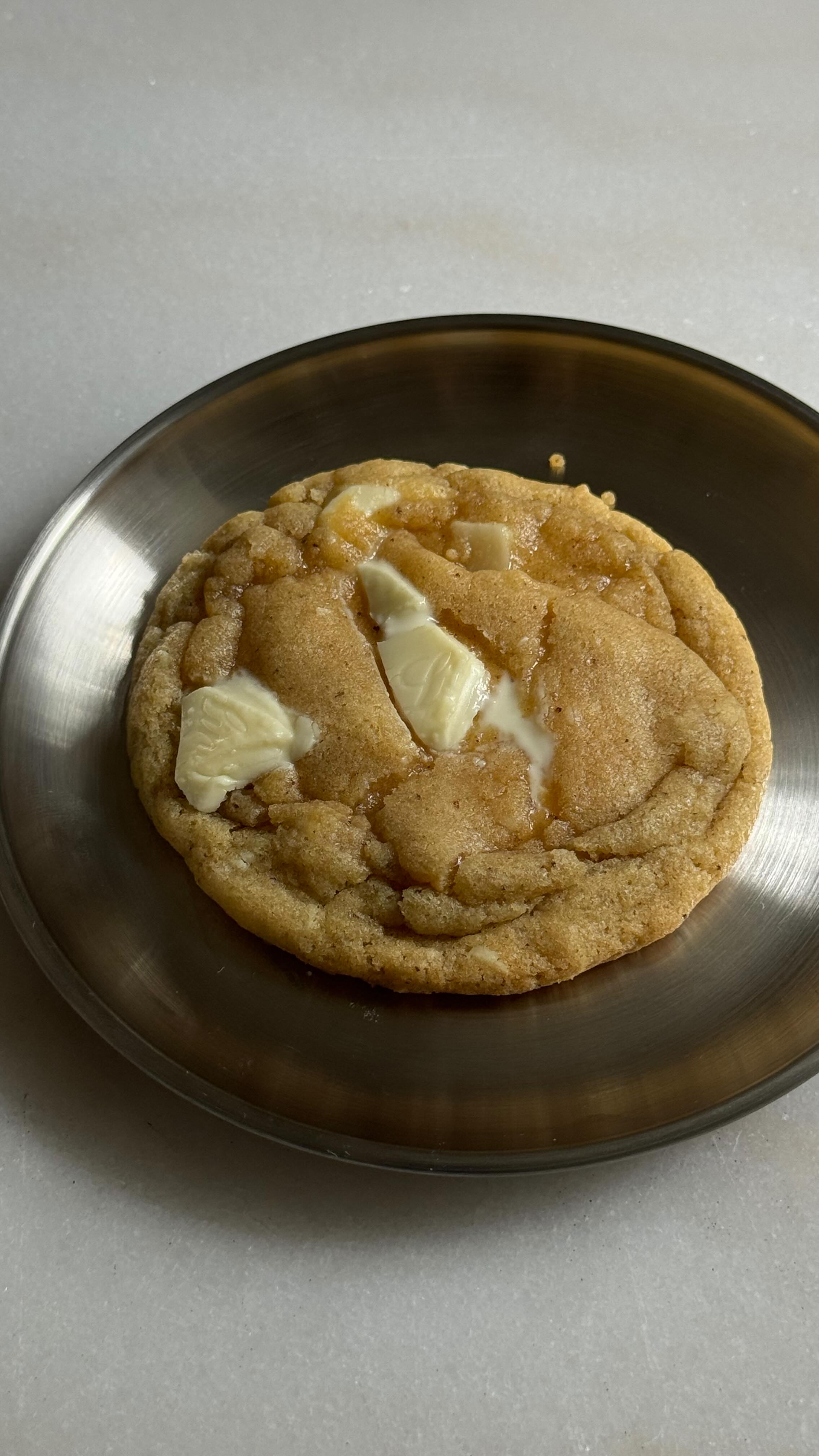 Instagram post by @figandoliveplatter for KerrygoldUSA. Caption reads: Brown Butter White Chocolate Macadamia Cookies 🤎....