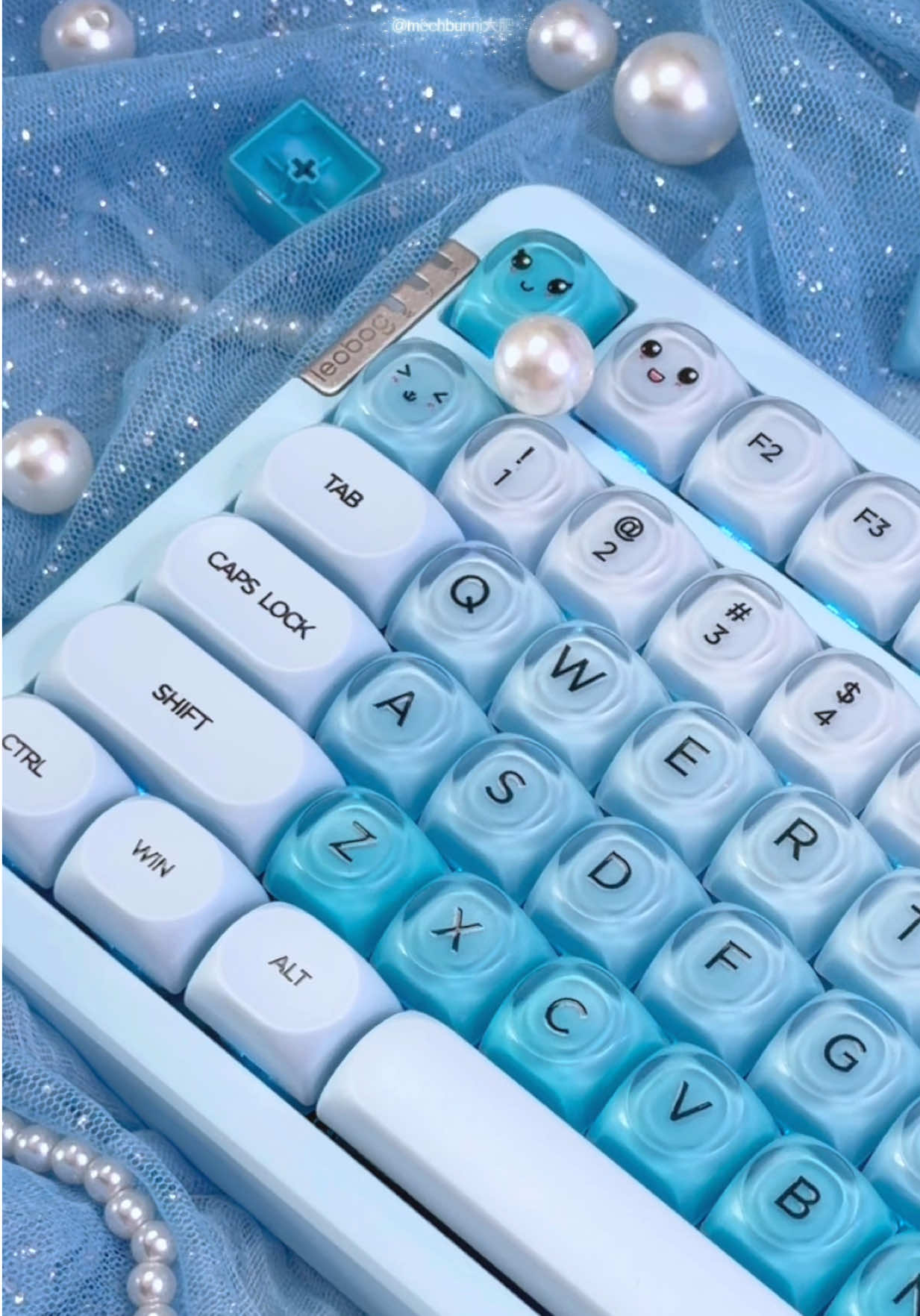 TikTok post by @mechbunni for Womier Keyboard. Caption reads: ASMR @Womier Keyboard Foundation Aqua keycaps on....