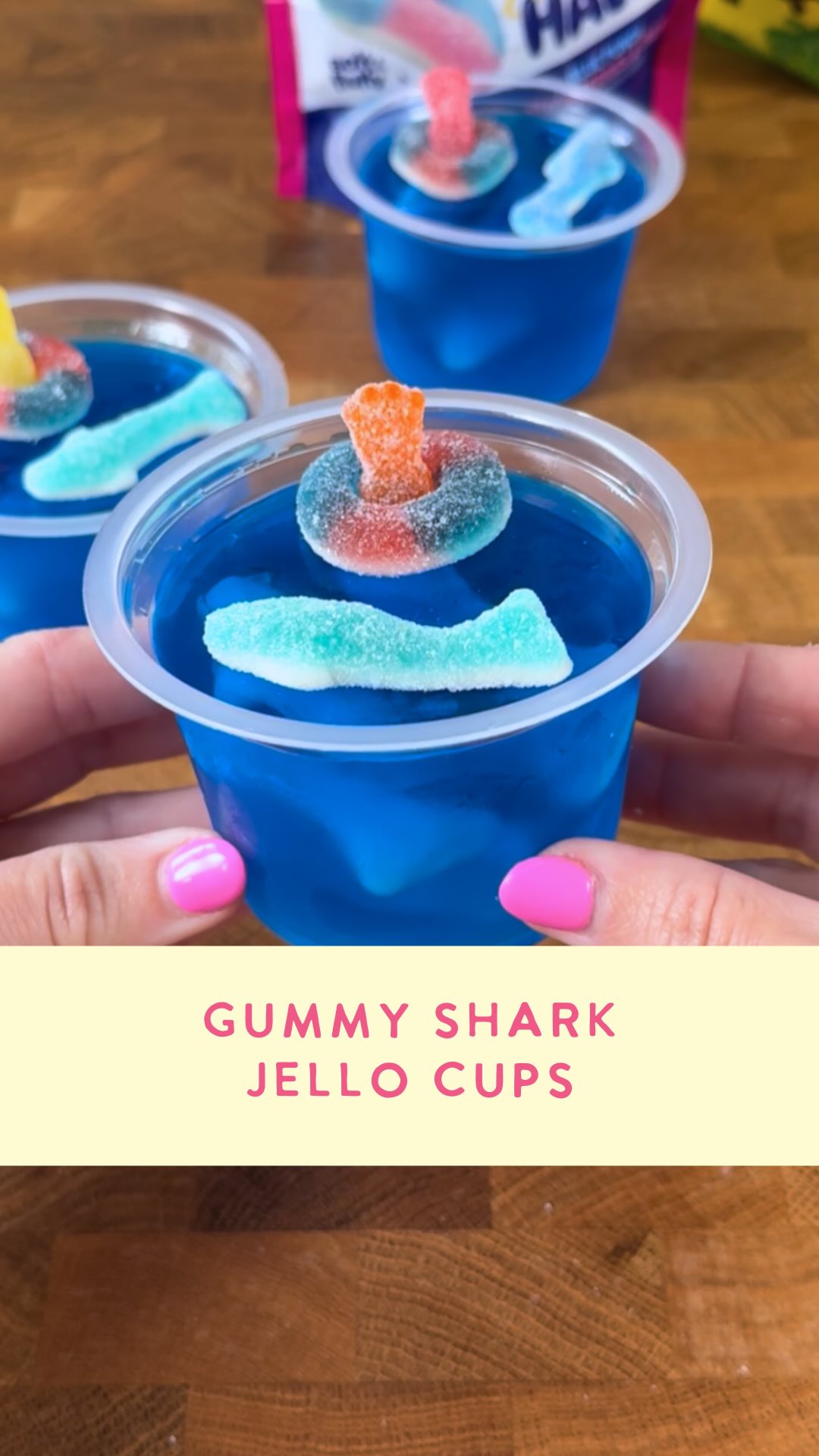 Instagram post by @lifeandsprinkles for Sour Patch Kids. Caption reads: Shark week jello cups 🦈🌊 these were super easy....