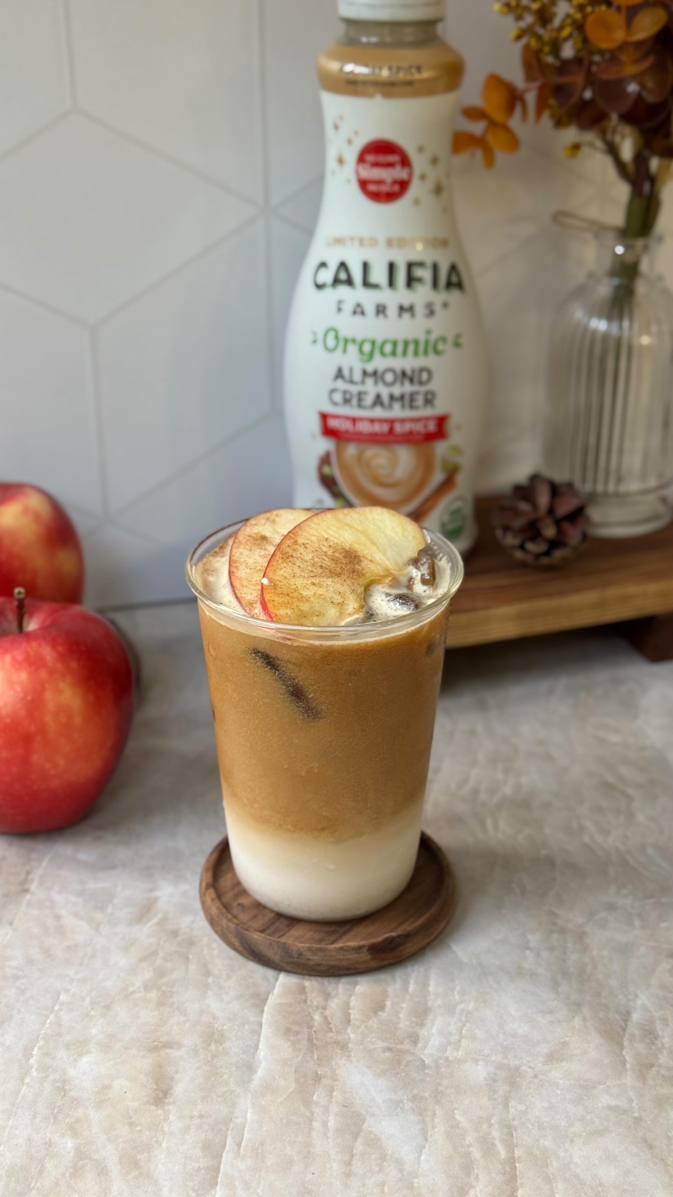 Instagram post by @milkteamali for Califia Farms. Caption reads: apple spice latte🍎 the perfect fall latte with....