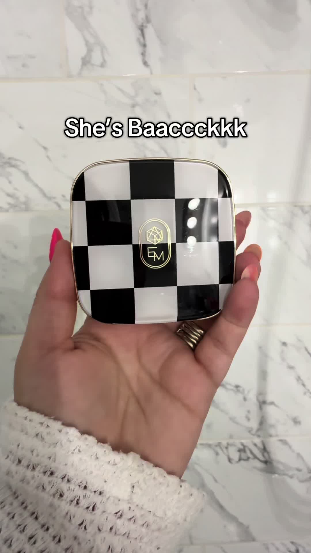 TikTok post by @debbiedagnese for EM Cosmetics. Caption reads: She’s Baaacckkk😍 @EM Cosmetics by Michelle Phan....