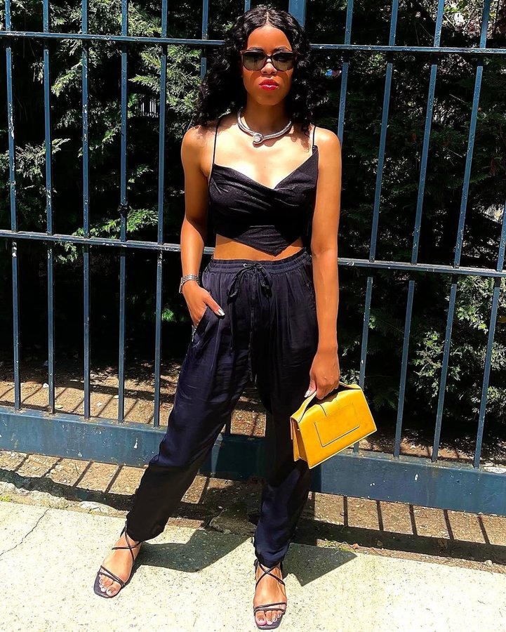 Instagram post by an influencer for boohoo. Caption reads: [...] Necklace: @amazonfashion Top: @boohoo Bag:....