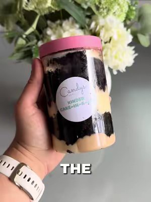 TikTok post by @the_hoppertons for Candy's Cupcakes. Caption reads: [...] @Candy’s Cupcakes #cake #cakeinajar....