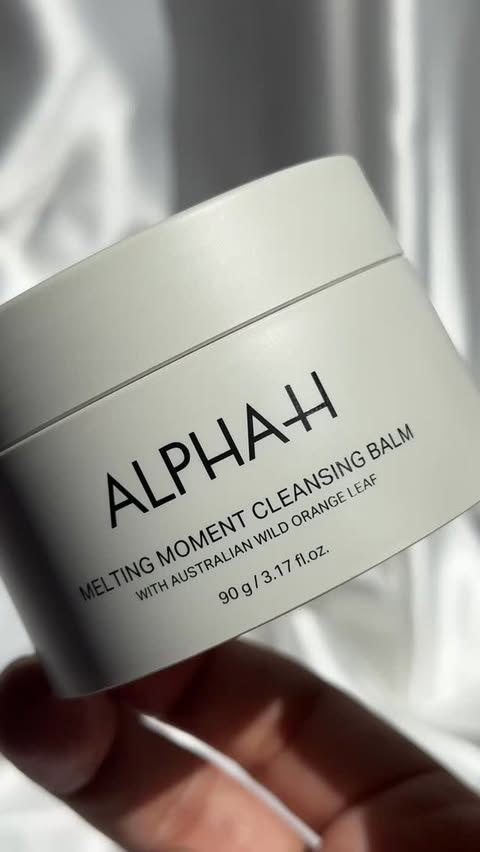 Instagram post by @minabutt84 for ALPHA-H. Caption reads: [...] from balm ➝ oil ➝ glow 🧈✨ Meet the Alpha-H....
