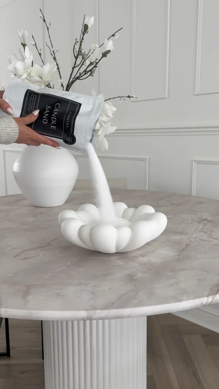 Instagram post by @emilymay_interior for Candlera Candle. Caption reads: This is the first time I’ve tried candle sand,....