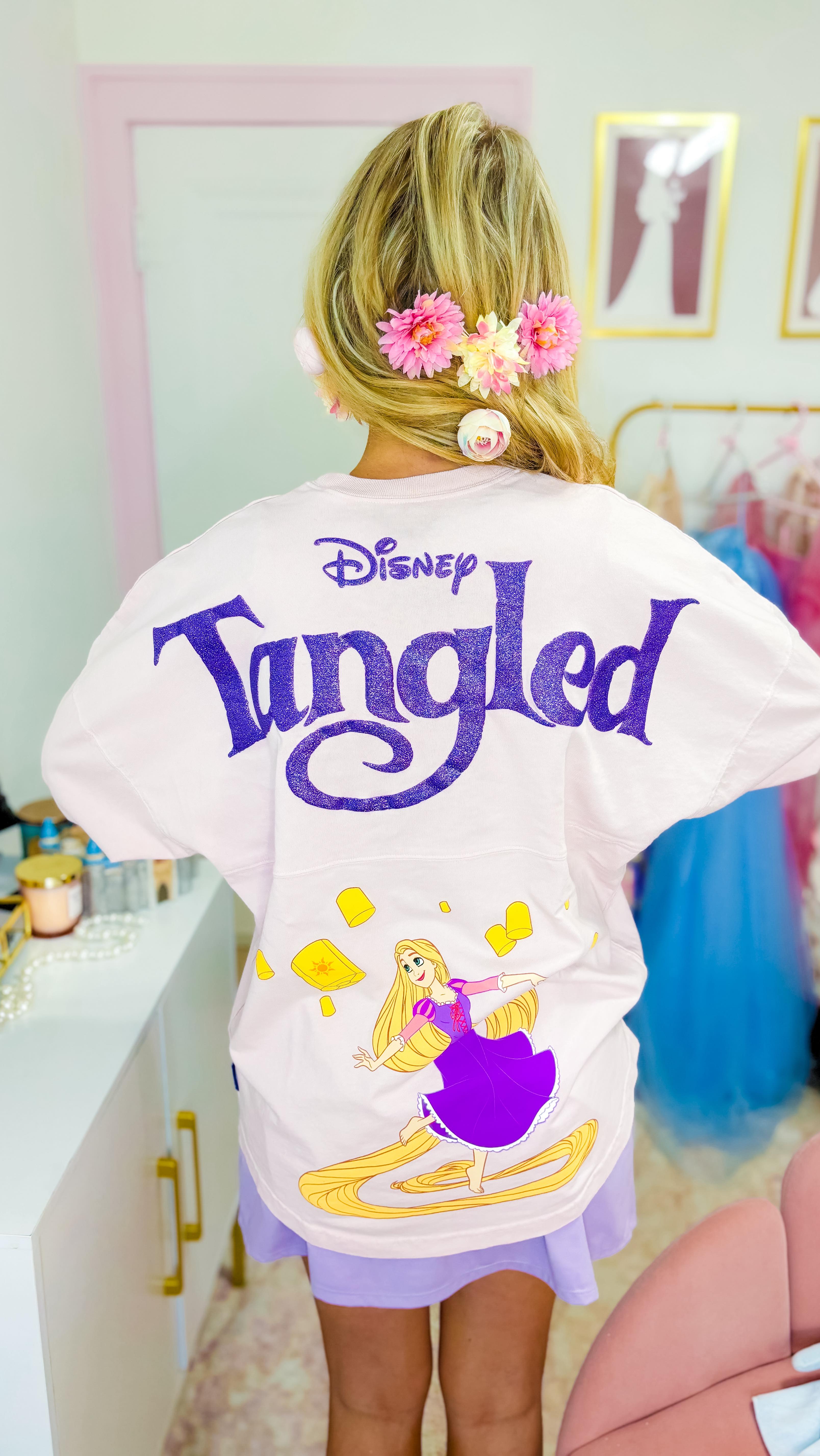 Instagram post by @emilyyyrosess for Spirit Jersey. Caption reads: [...] Rapunzel and Disney Princess Belle Spirit....