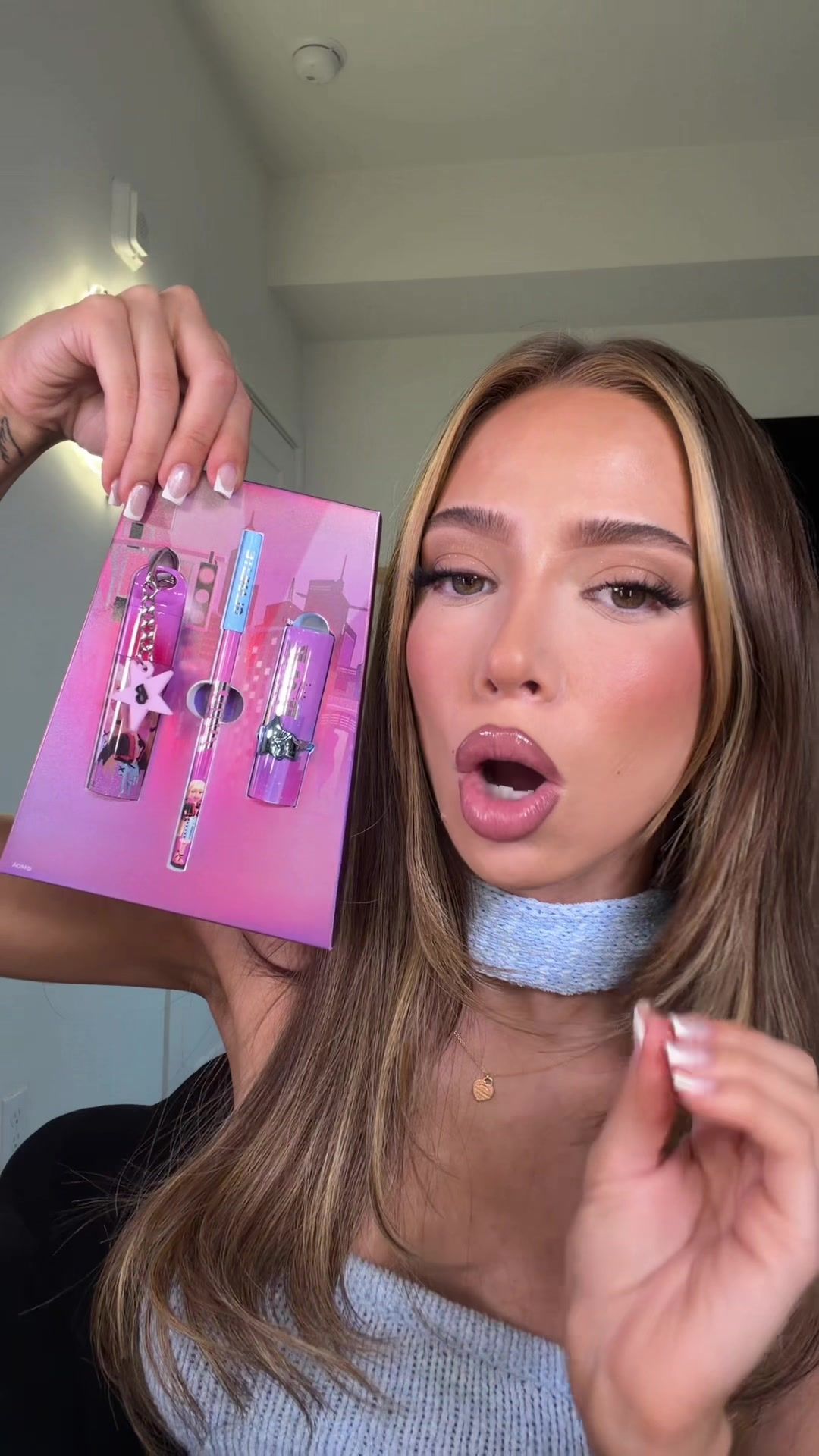 TikTok post by @xoxodoseofjos for Glamlite. Caption reads: @Glamlite Packaging 10/10 GLITTER GLOSS 1000/10....