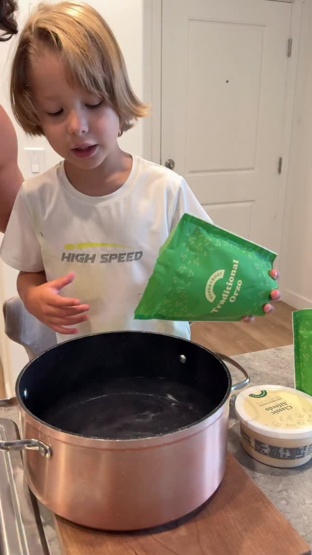 Instagram post by @moniquecesd for Hungryroot. Caption reads: 🇺🇸 Today Axel cooked with his daddy! All....