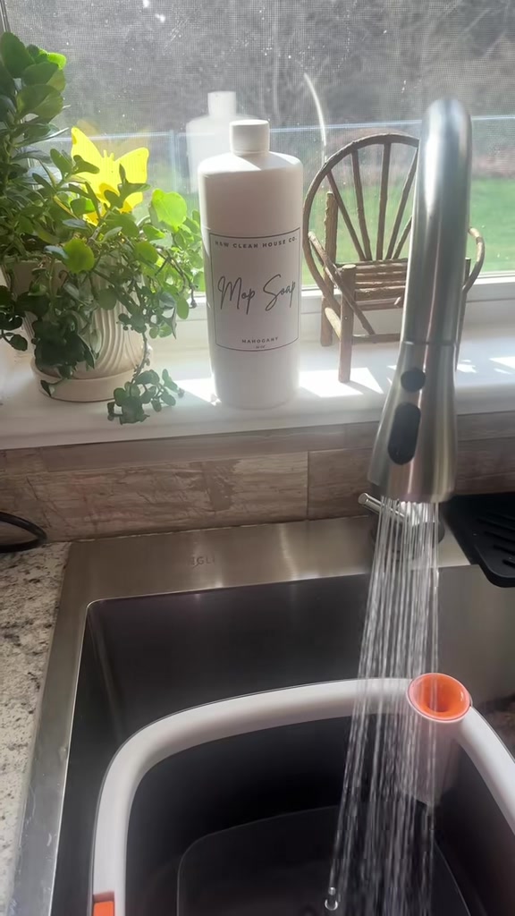TikTok post by @_hannah_green_ for H&W Bath Haus. Caption reads: [...] #cleaningtiktok #moppingthefloor @H&W Bath....