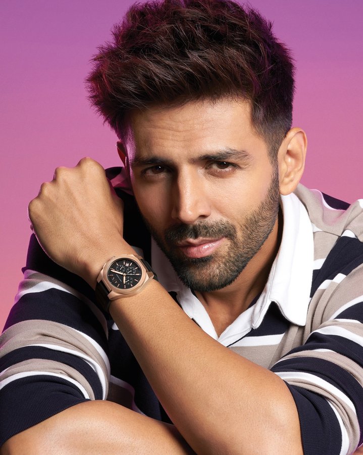 Instagram post by @kartikaaryan for Armani Exchange. Caption reads: Iss watch ka kaam sirf ek hai- Attention attract....