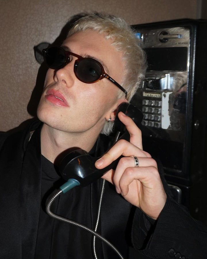 Instagram post by @tannerareese for EssilorLuxottica. Caption reads: pick up the phone @giorgioarmani @essilorluxottica....