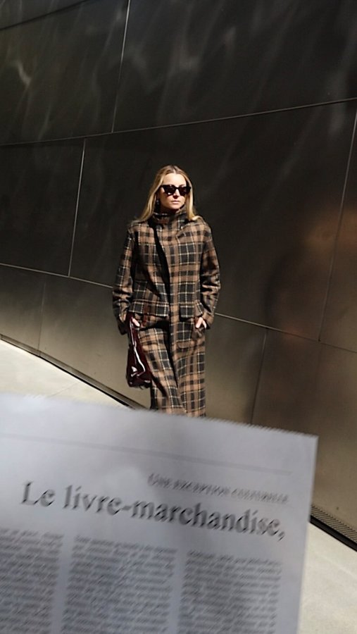 Instagram post by @juliacomil for Billy Reid. Caption reads: Layering up for fall with the buckle-neck coat by....