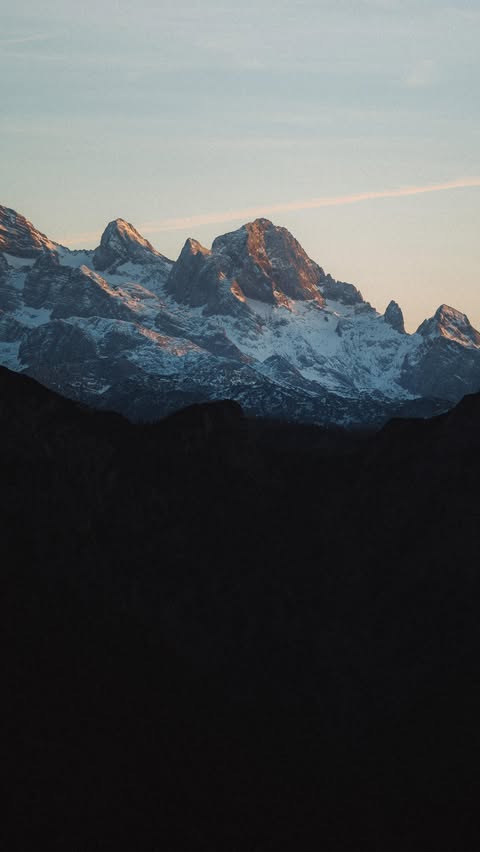 Instagram post by @constantinseuss for RevolutionRace. Caption reads: Chasing golden hours and staying warm while on the....