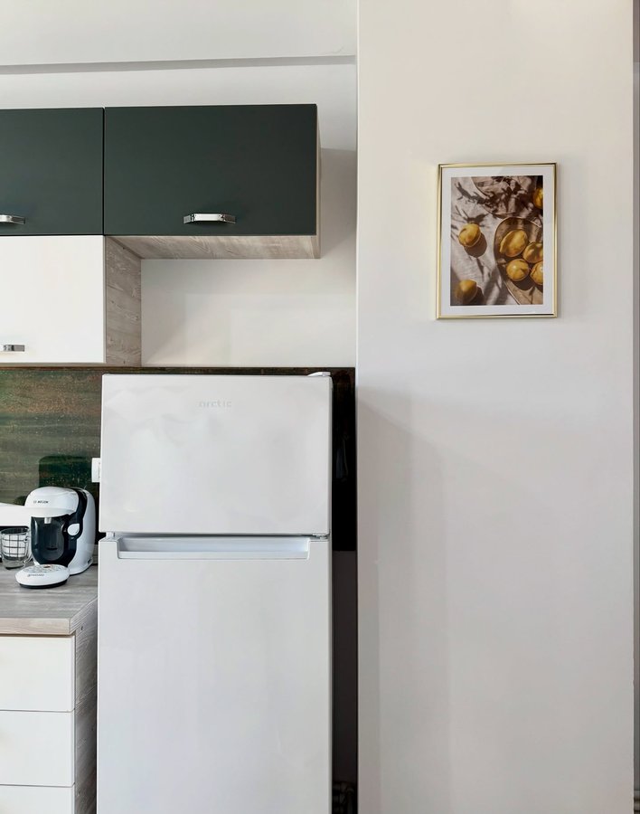 Instagram post by @alinaalina27m for Brandbassador. Caption reads: A touch of art makes even the kitchen feel....