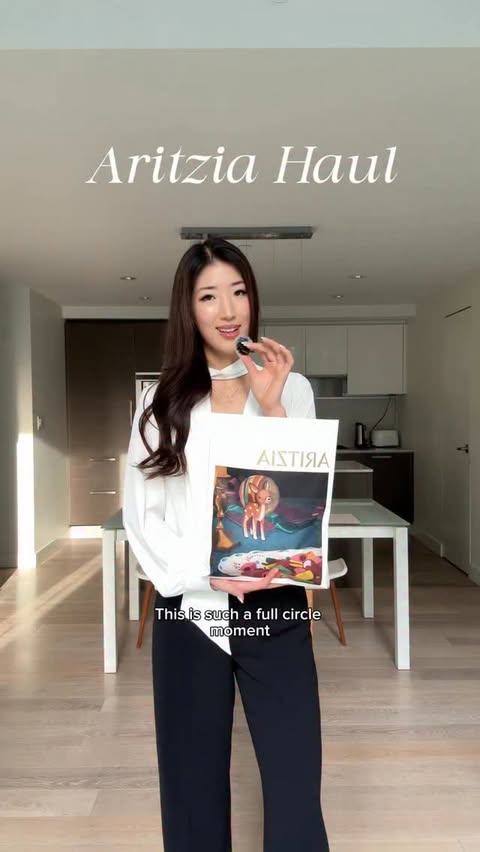 Instagram post by @melissasollee for Aritzia. Caption reads: A pinch-me moment 🤍 @aritzia 

#aritziastyle....