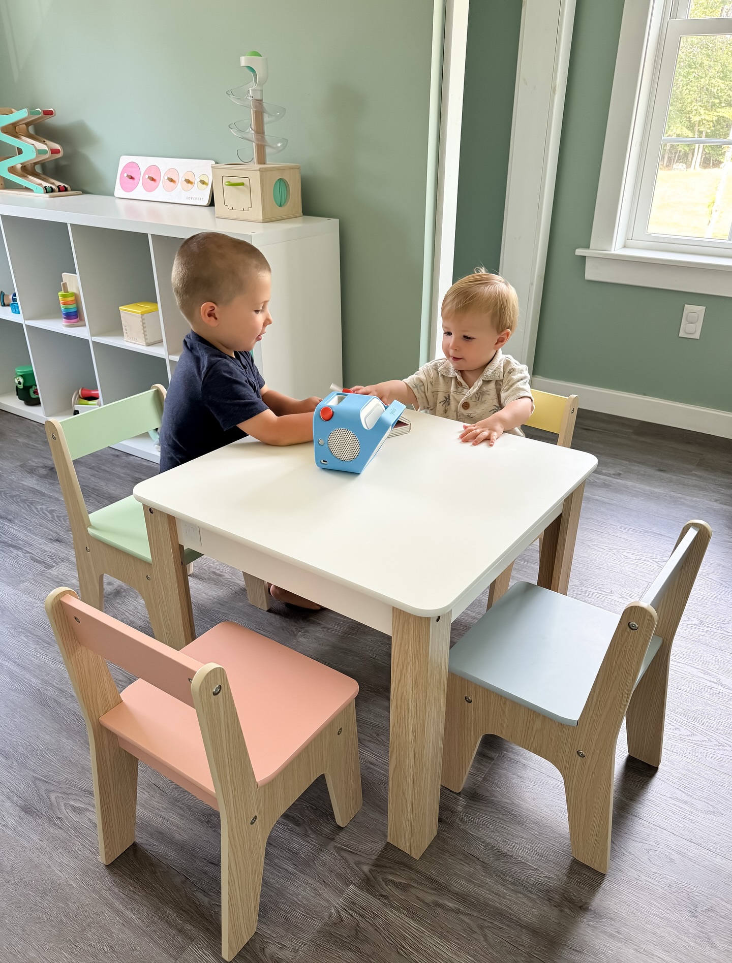 Instagram post by @christinaemiller for Delta Children. Caption reads: I got a cute new table and chairs set for the boys....