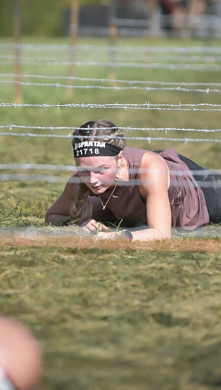 Instagram post by @mrs.mlwilliams for Spartan. Caption reads: Our first Spartan Race and I think it's safe to....