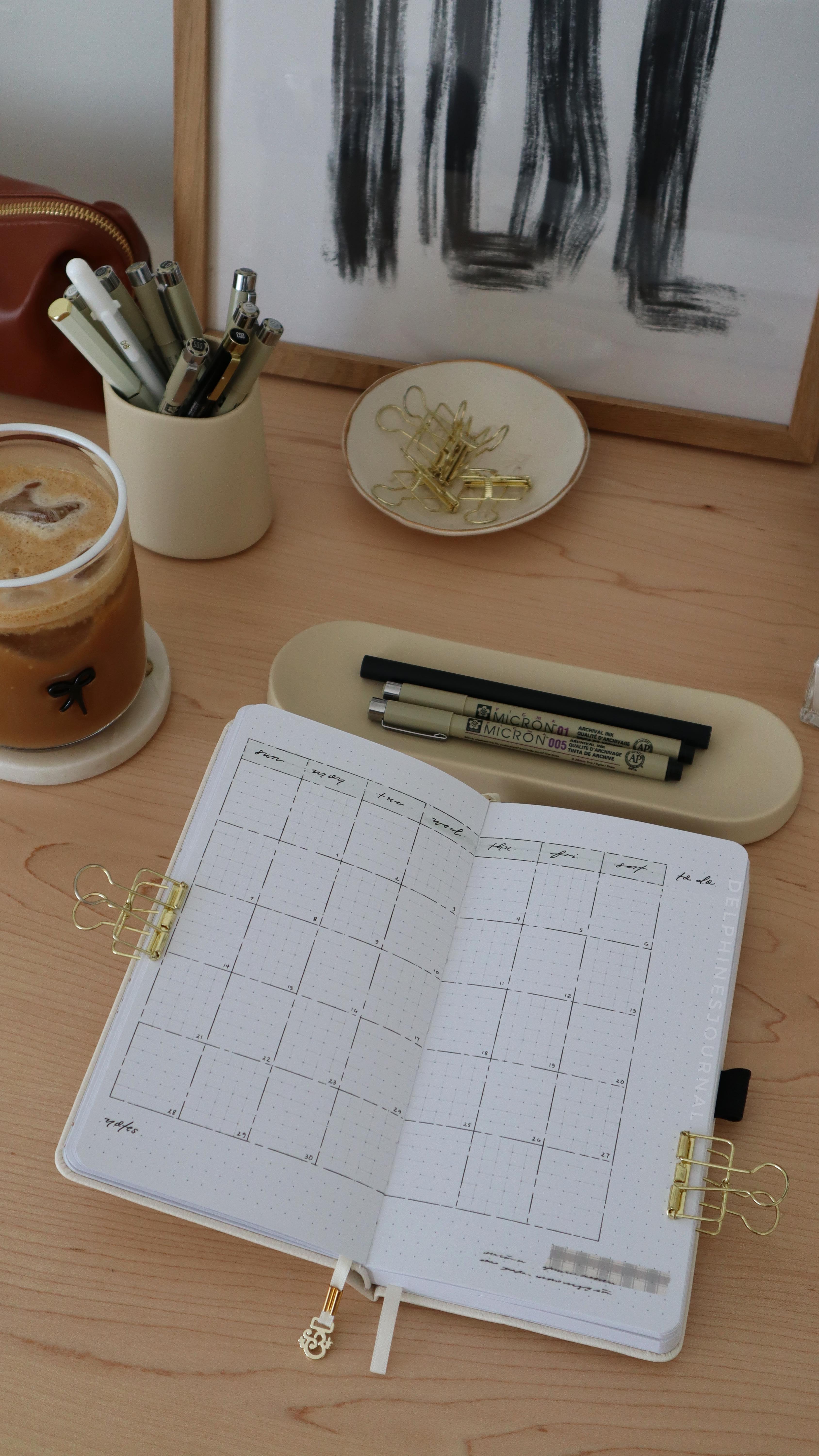 Instagram post by @delphinesjournal for Archer and Olive. Caption reads: Using a traveler’s notebook this month also means....